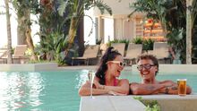 a couple in a hotel pool
